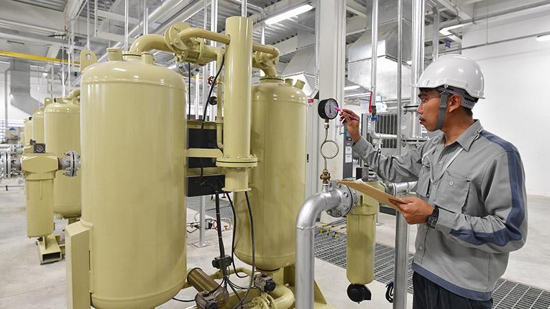 Technician checking a compressed air system