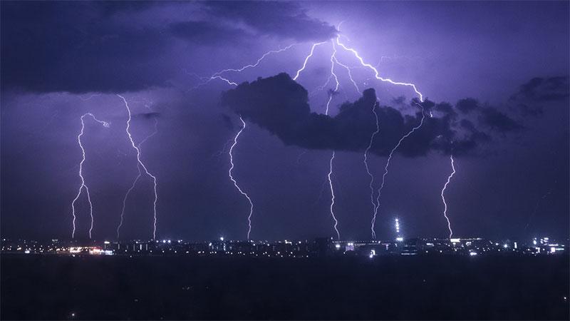 Lightning strikes over city