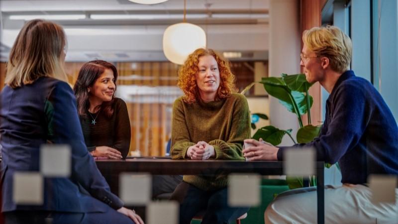 Team discussing in Vaisala Keilaniemi office lounge